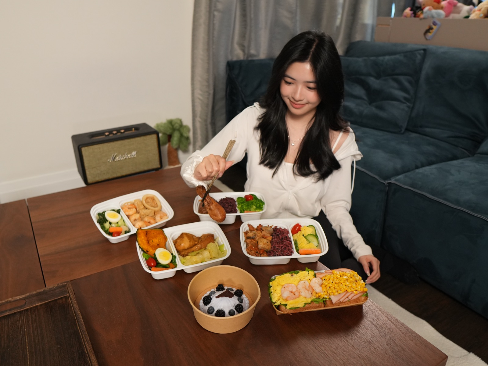 A customer enjoying calorie-controlled Asian FitBox meals at home